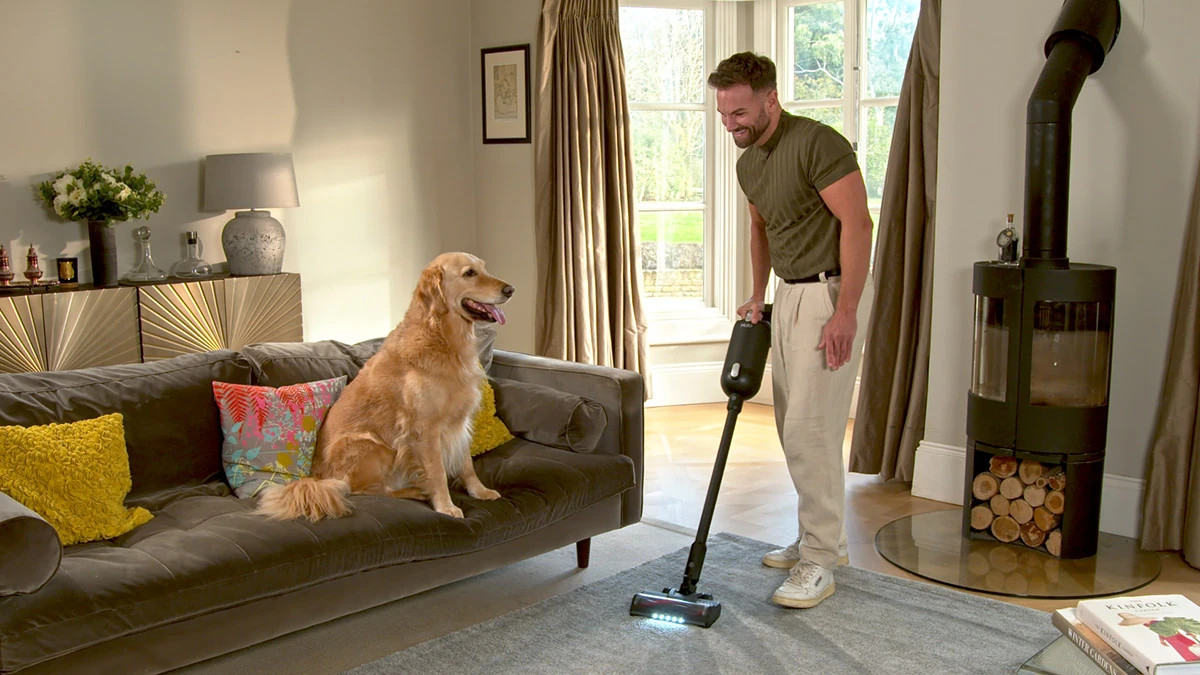 Halo Capsule XR cordless vacuum cleaning a living room floor