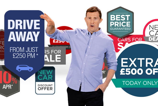 Carwow's Mat Watson walking through 3d car finance sales signs