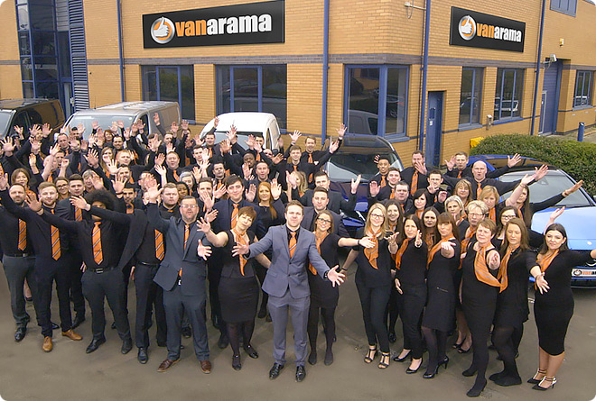 Vanarama's staff pose together for a group photograph in front of their office building.